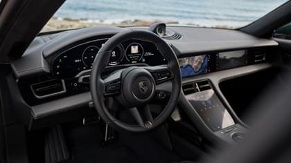 the interior of a car with a steering wheel and dashboard