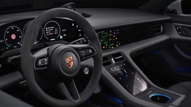 the steering wheel and dashboard of a car