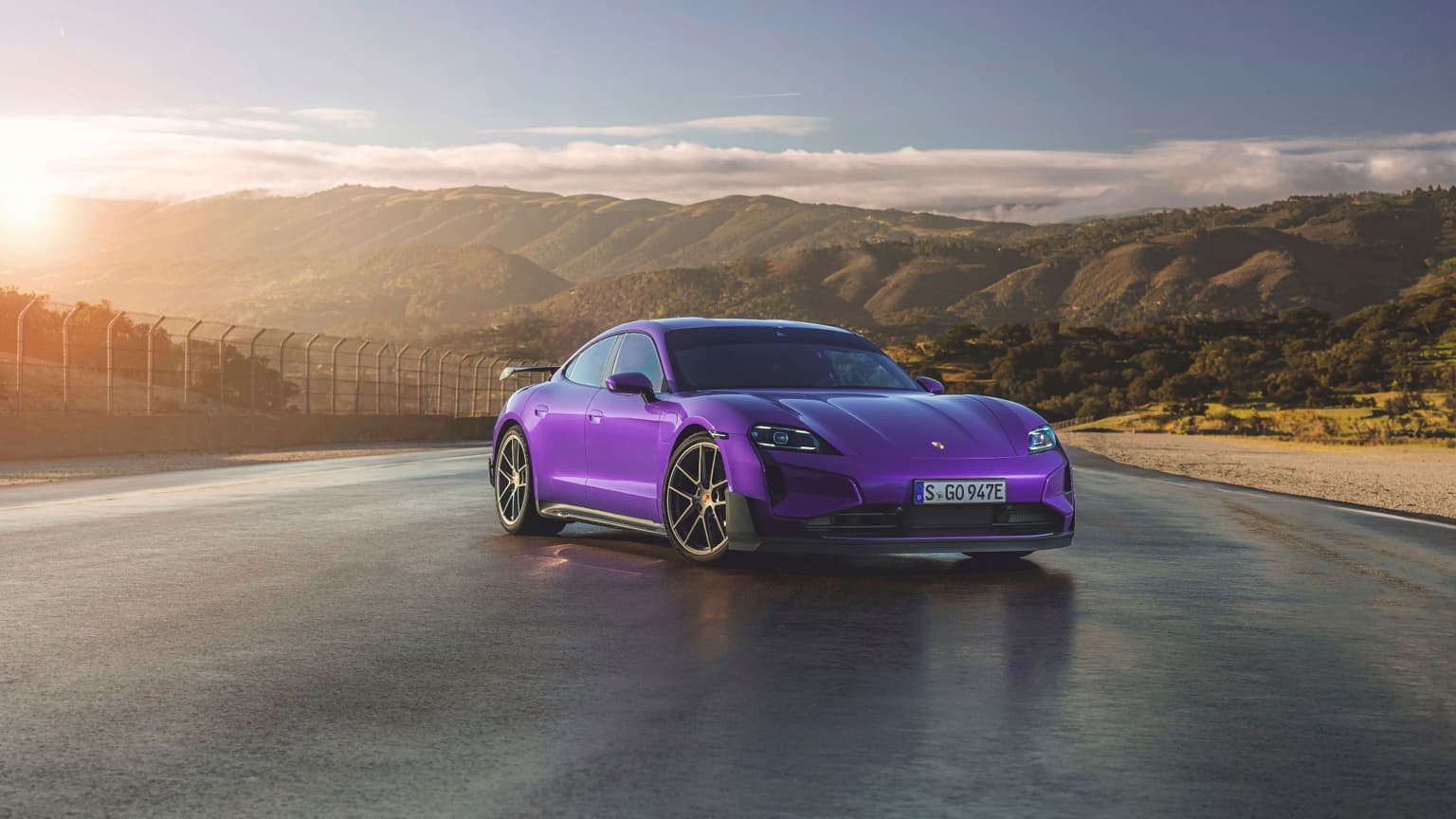 a purple sports car on a road