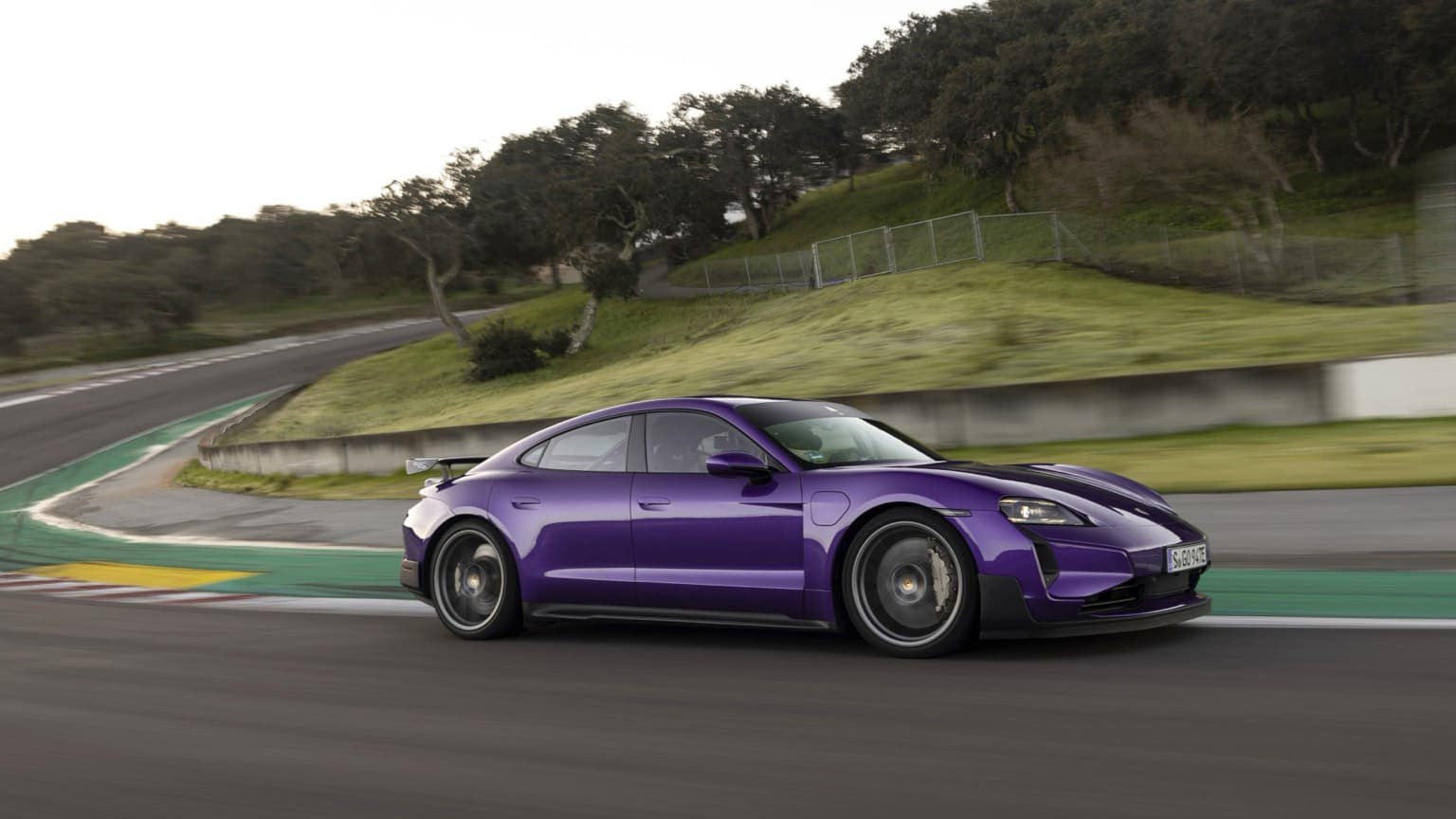 a purple sports car on a road