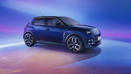 a blue car parked on a reflective surface