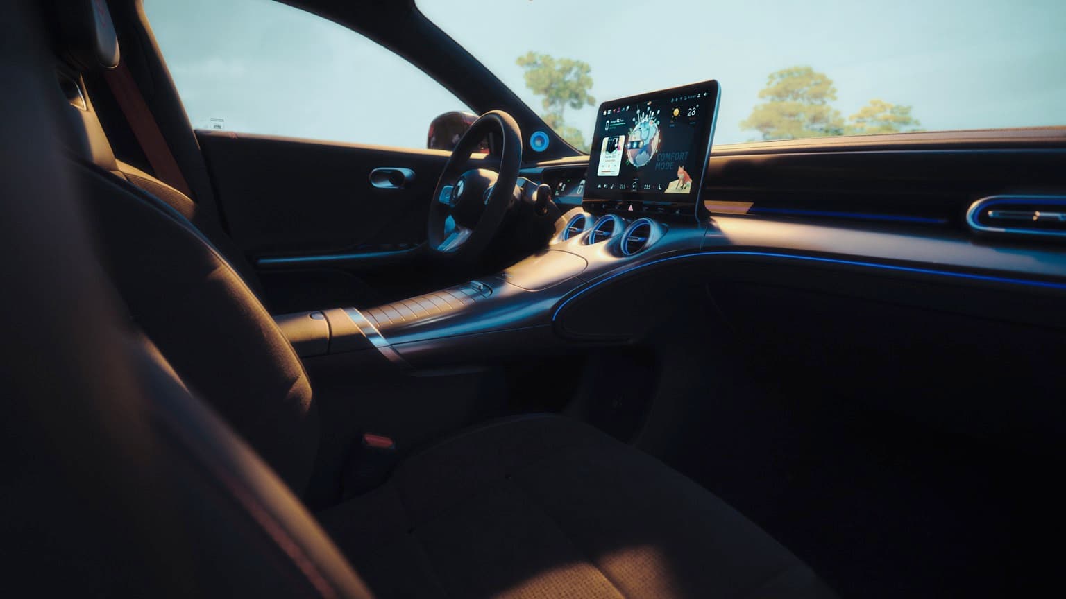 the inside of a car with a laptop on the dashboard