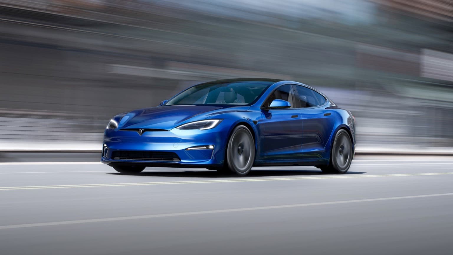 a blue car on a road