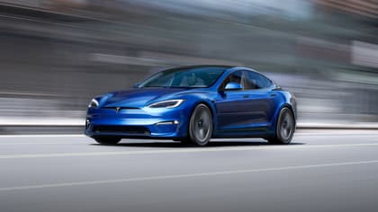 a blue car on a road