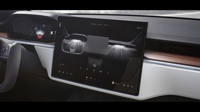 a screen on the dashboard of a car