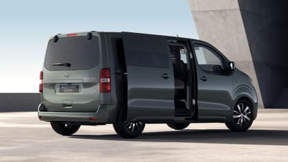 a green van with its doors open