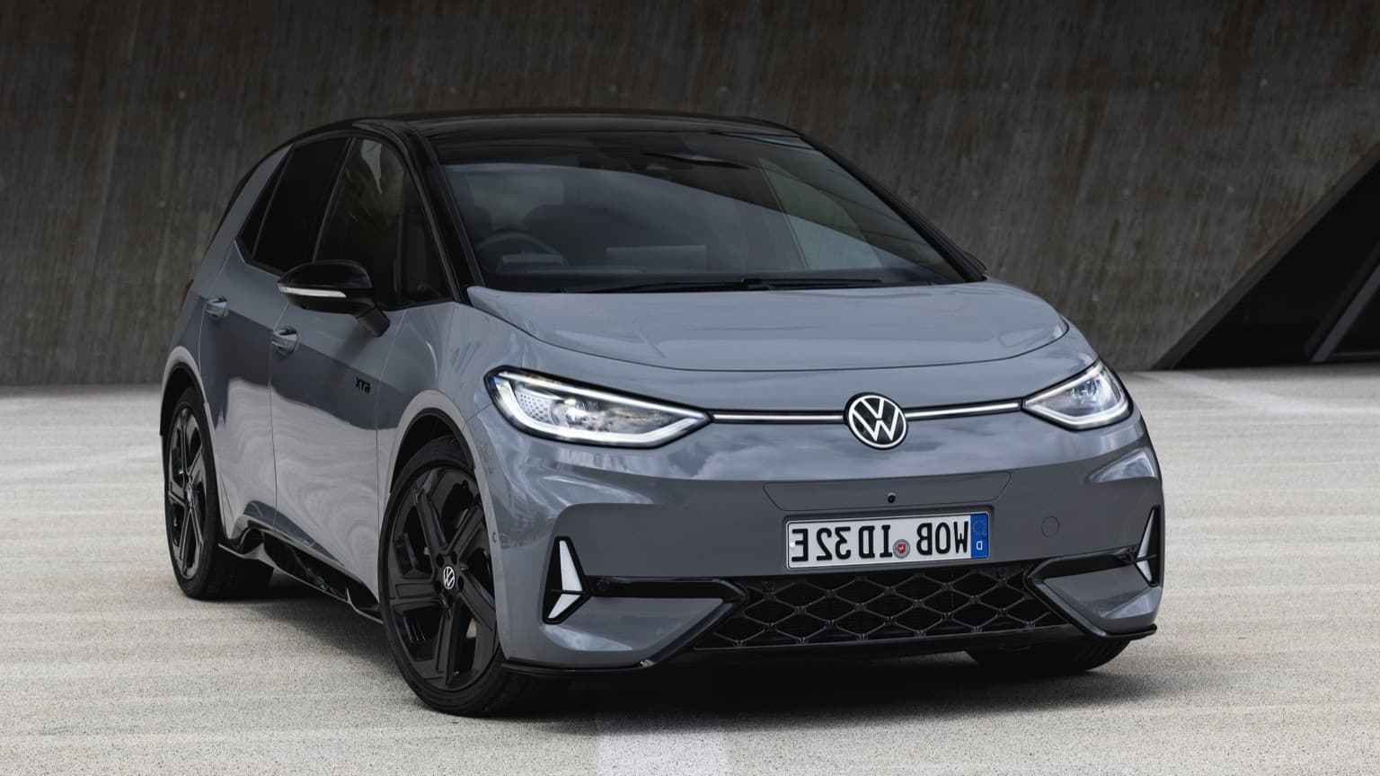 a grey car parked on pavement