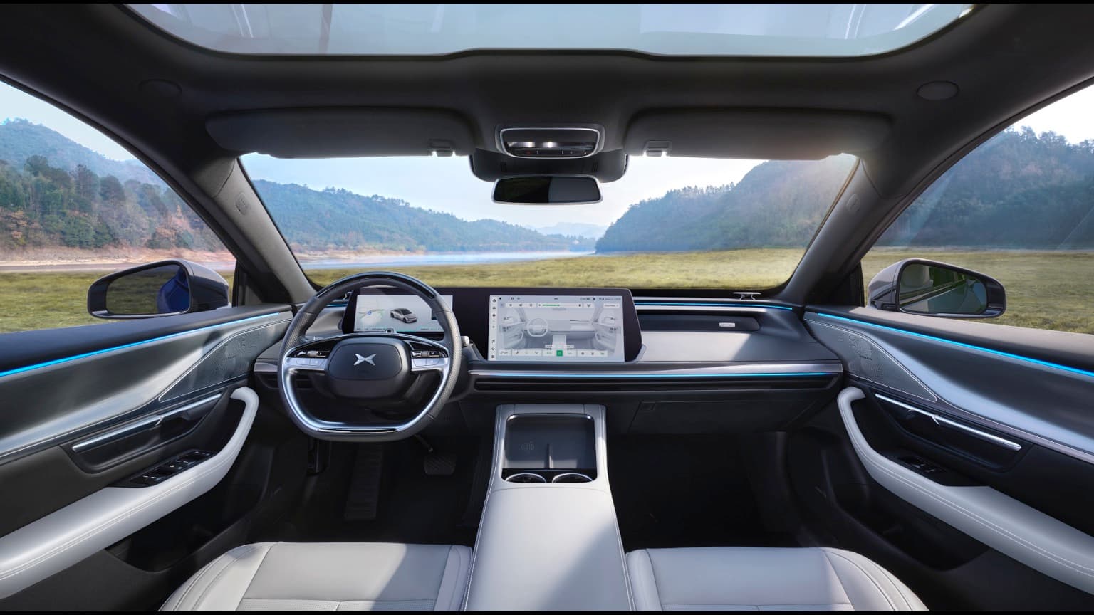 inside a car with a steering wheel and dashboard