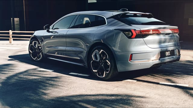a silver car parked on a road