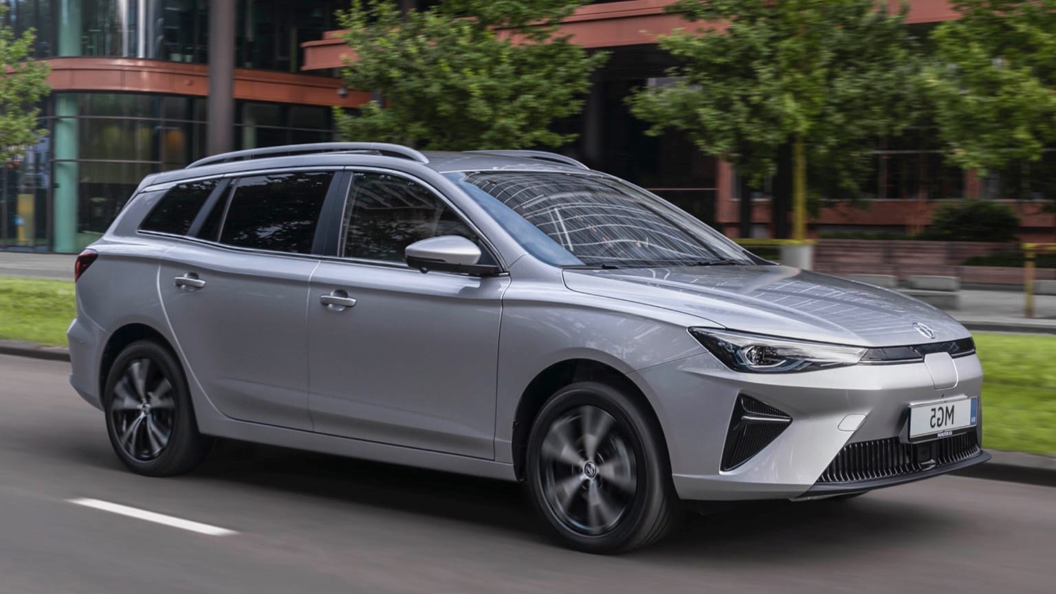 a silver car on the road