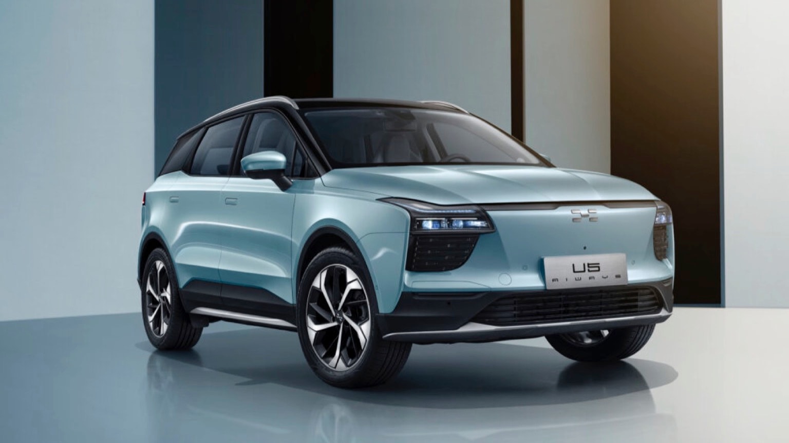 a blue suv parked in a room