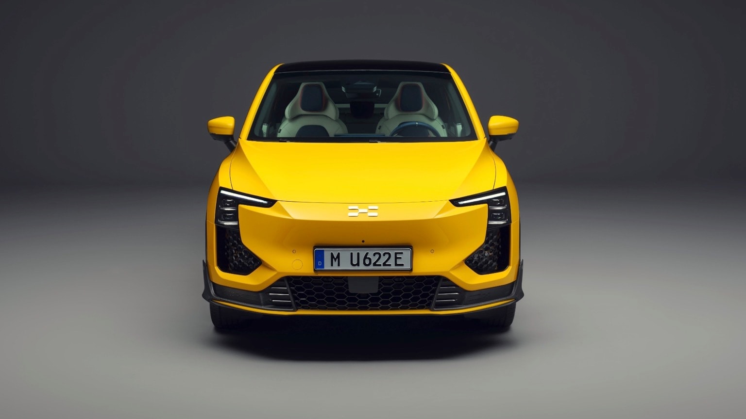 a yellow car with a black background