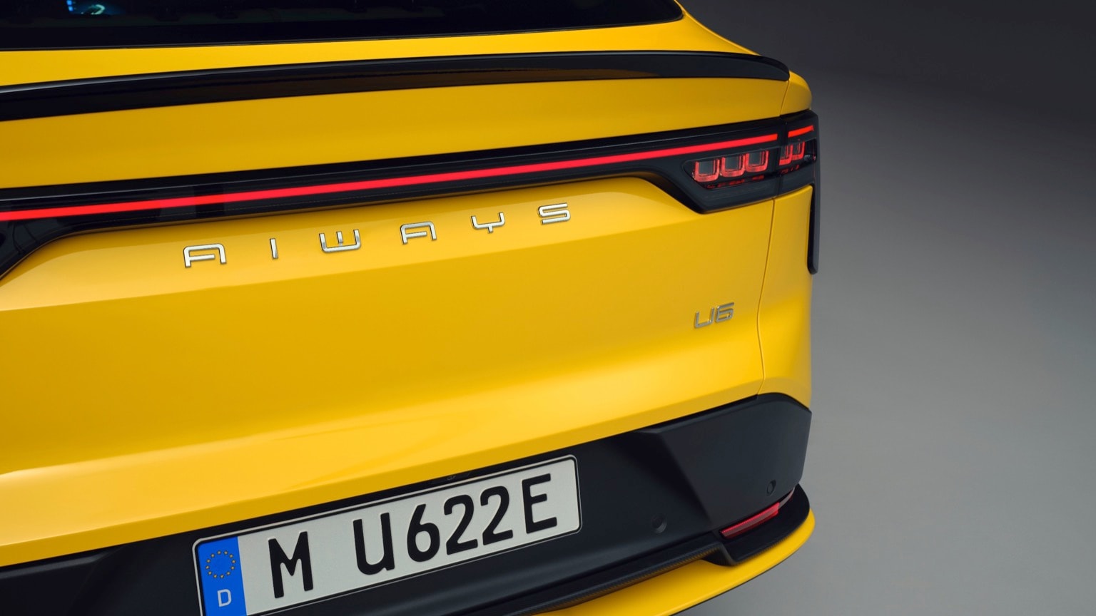 the back of a yellow car
