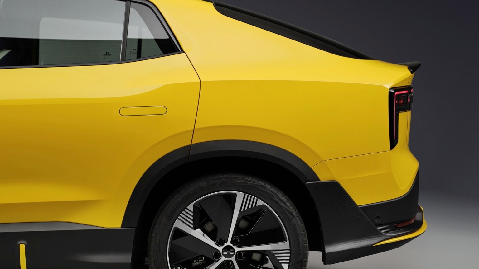 the back of a yellow car