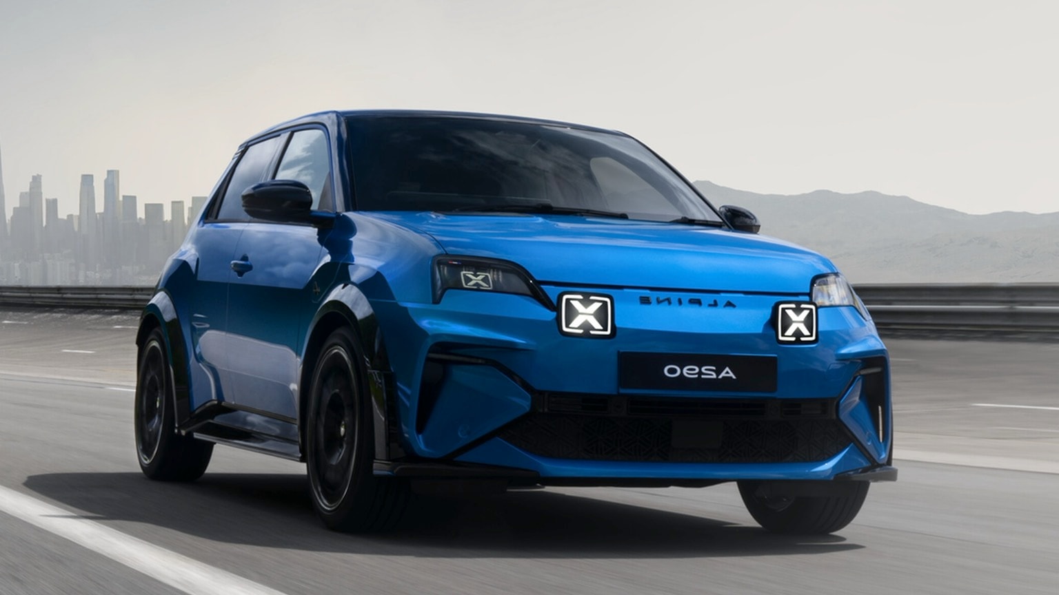 a blue car on a road