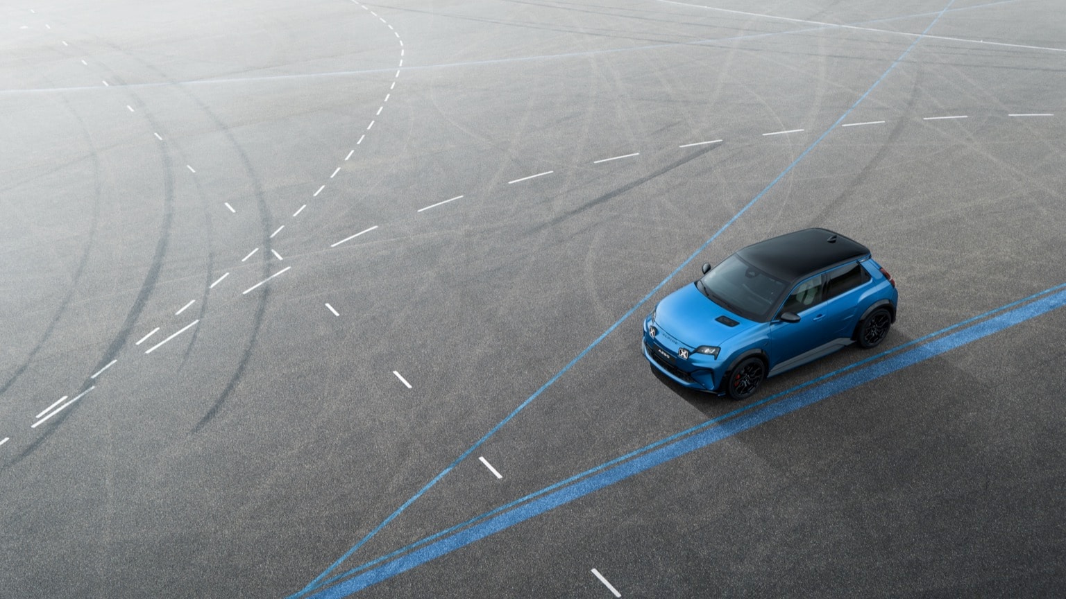a blue car on a road