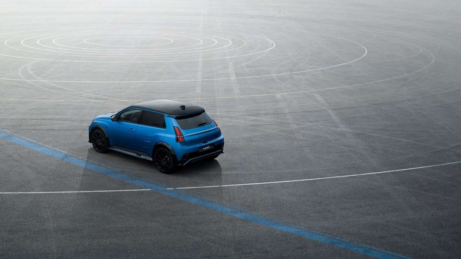 a blue car on a road