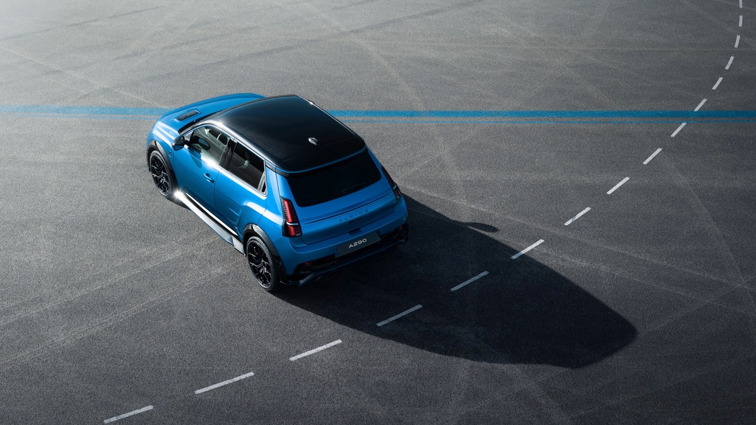 a blue car parked on a road