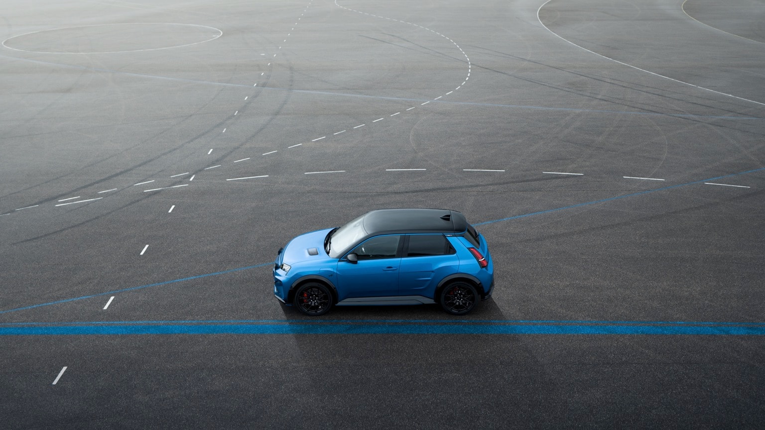 a blue car on a road