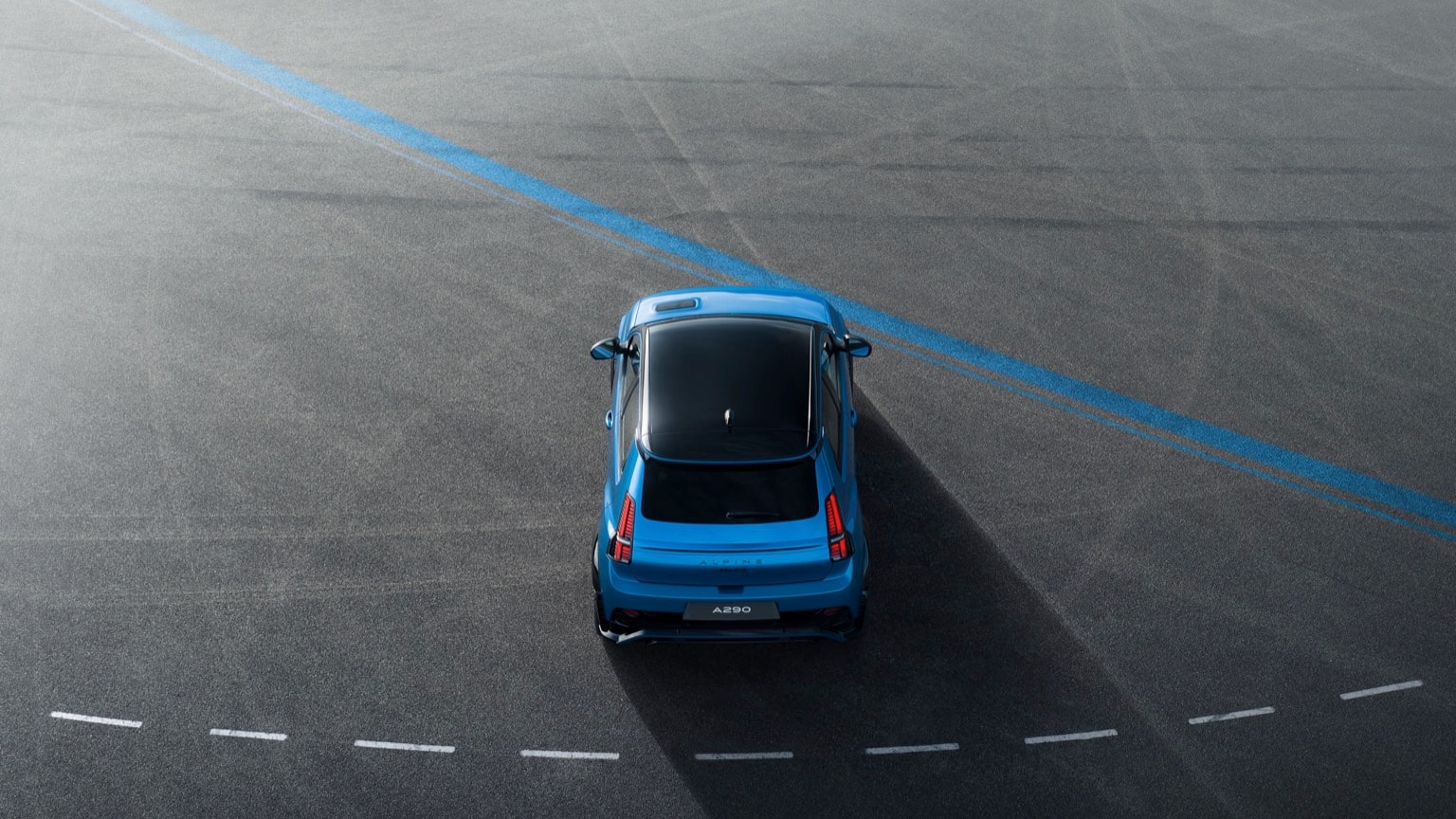 a blue car on a road