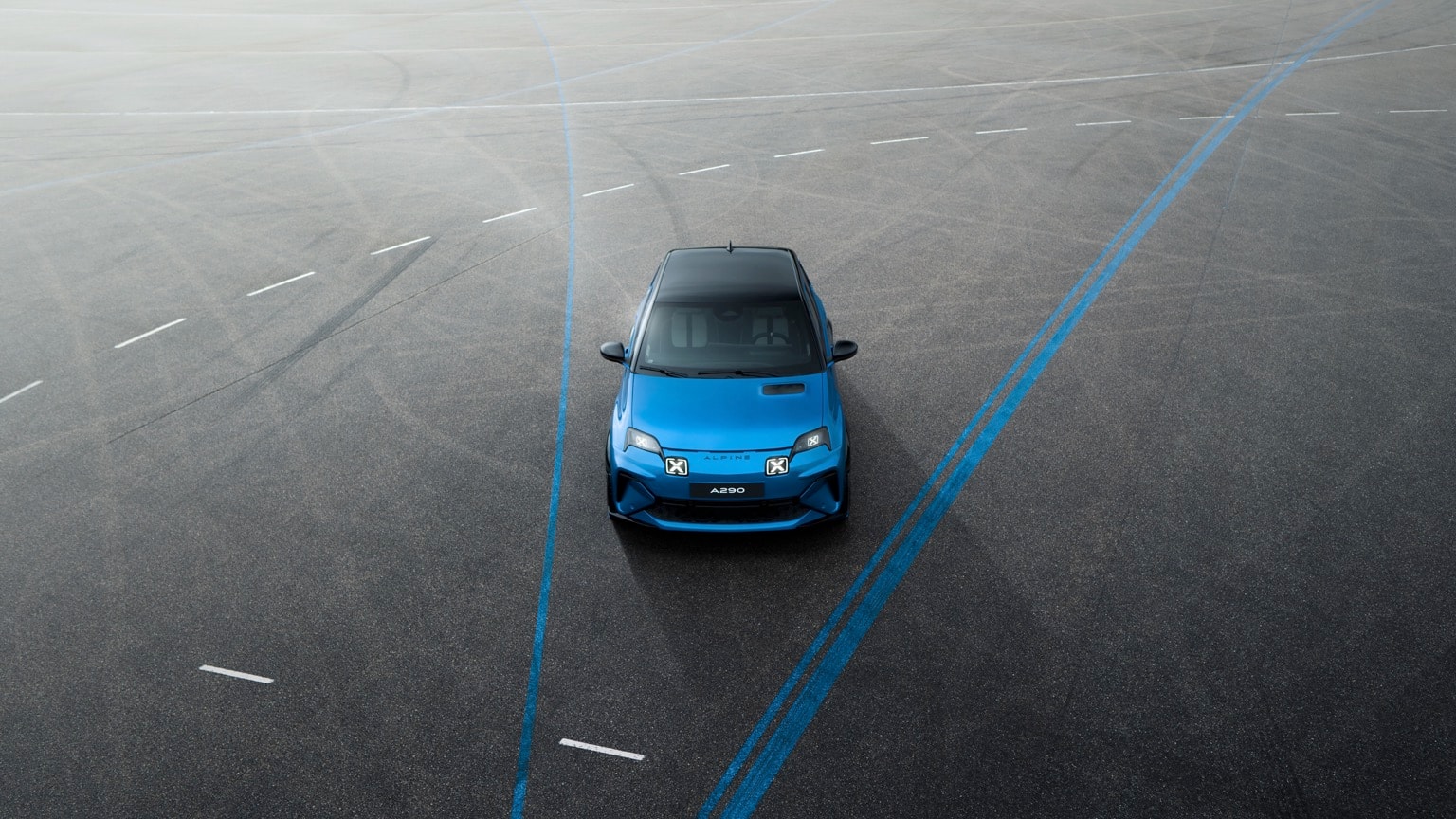 a blue car on a road