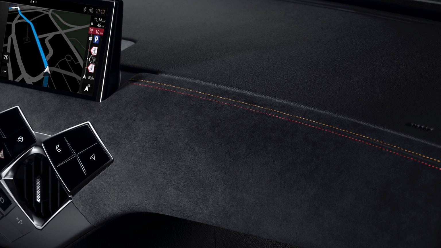 a phone on the dashboard of a car
