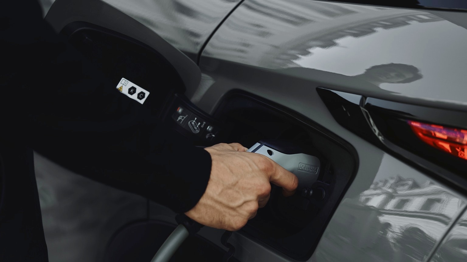a person holding a gas pump