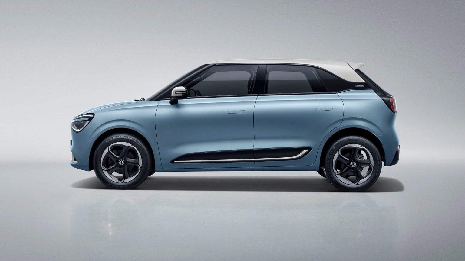 une voiture bleue avec un toit blanc