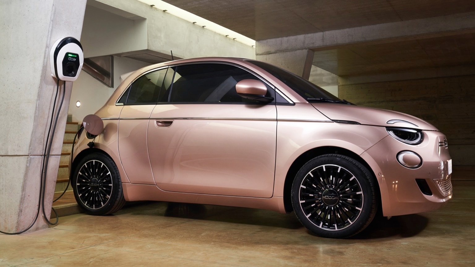 a pink car parked in a garage