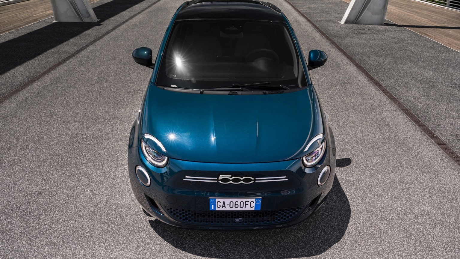 a blue car parked on a road