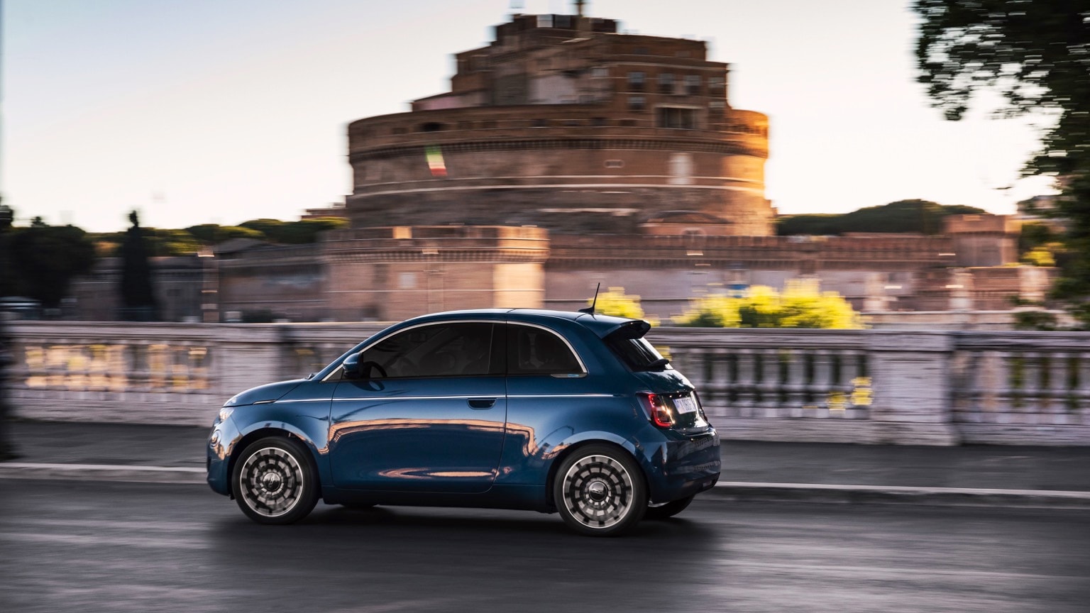 a blue car on a road