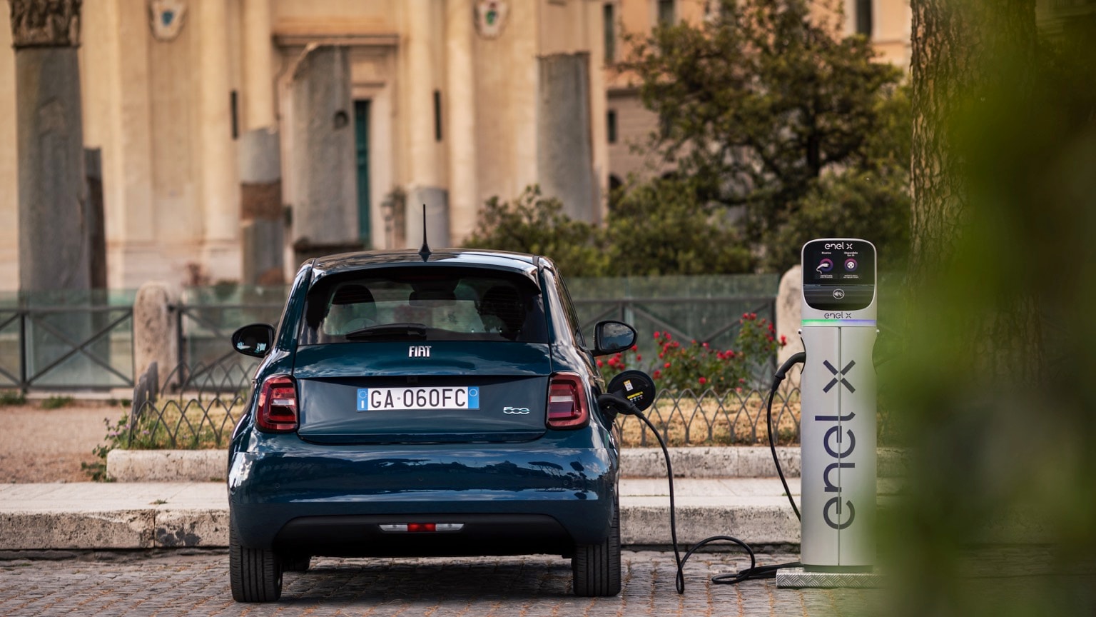 a car charging at a charging station