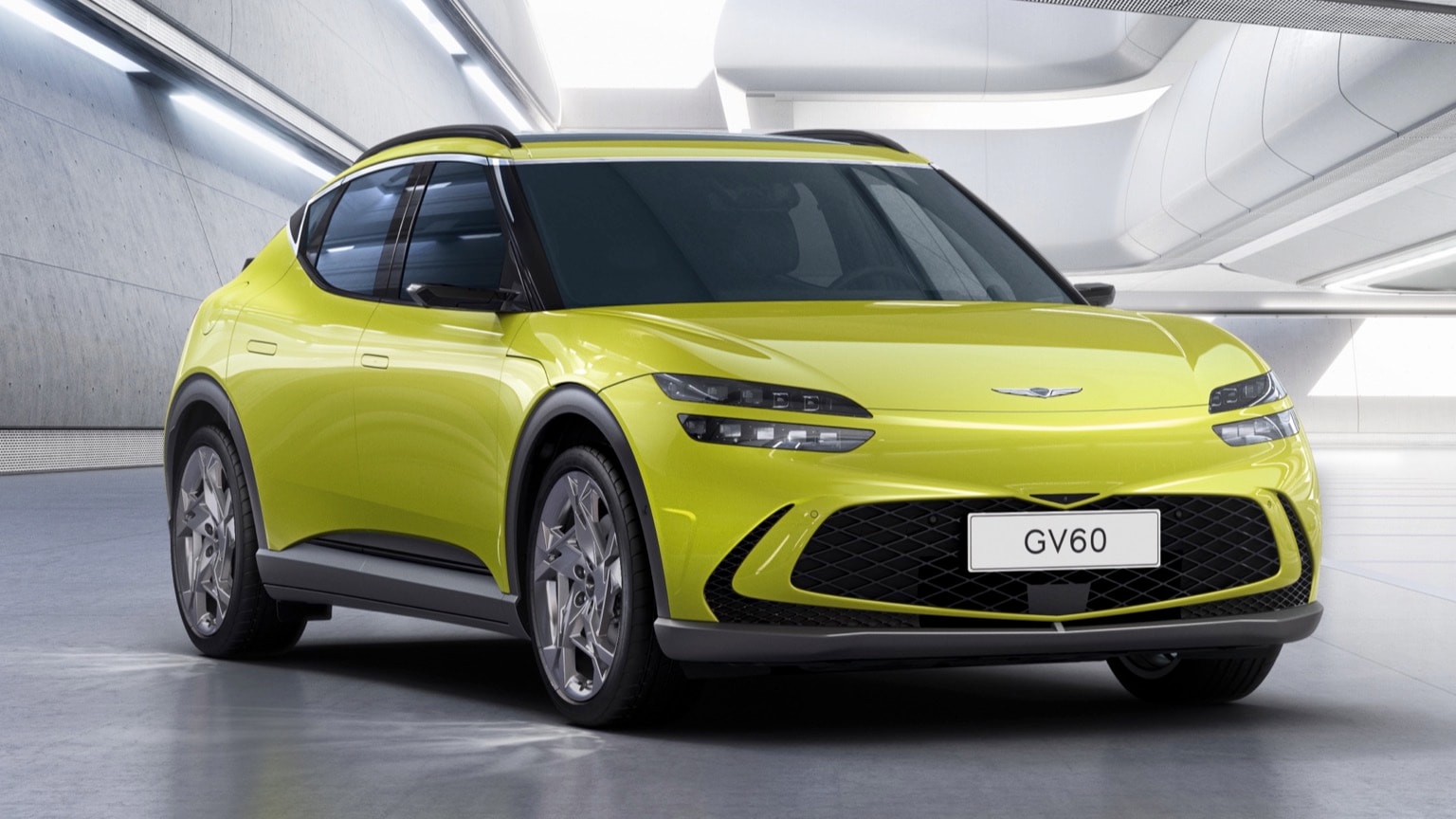 a green car parked in a room
