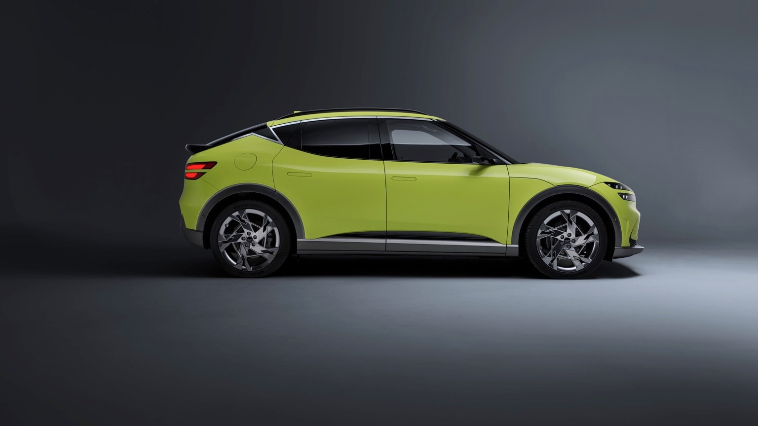 a green car parked in a room