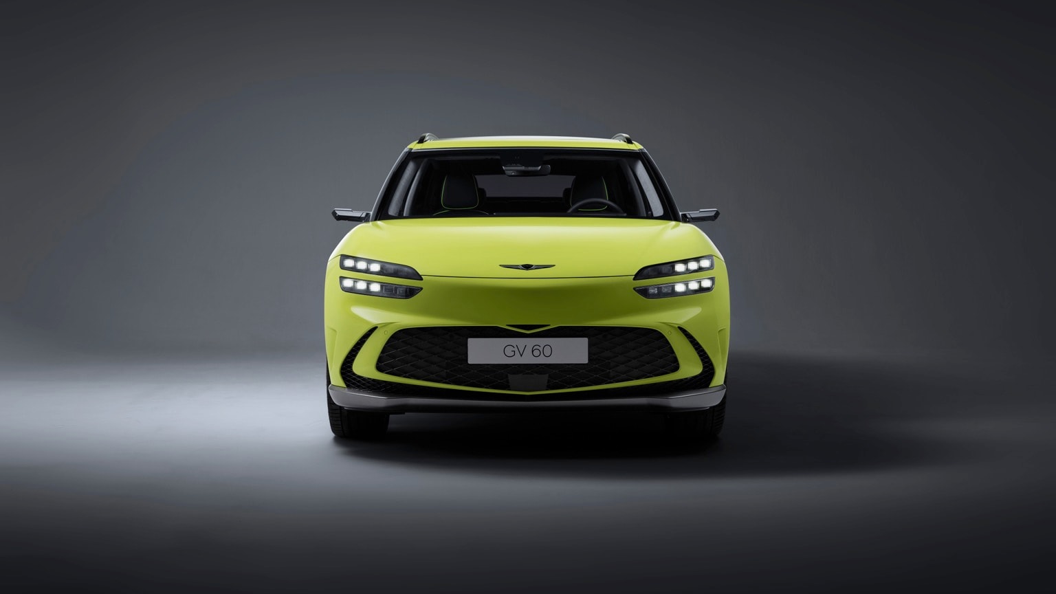 a green car with lights on