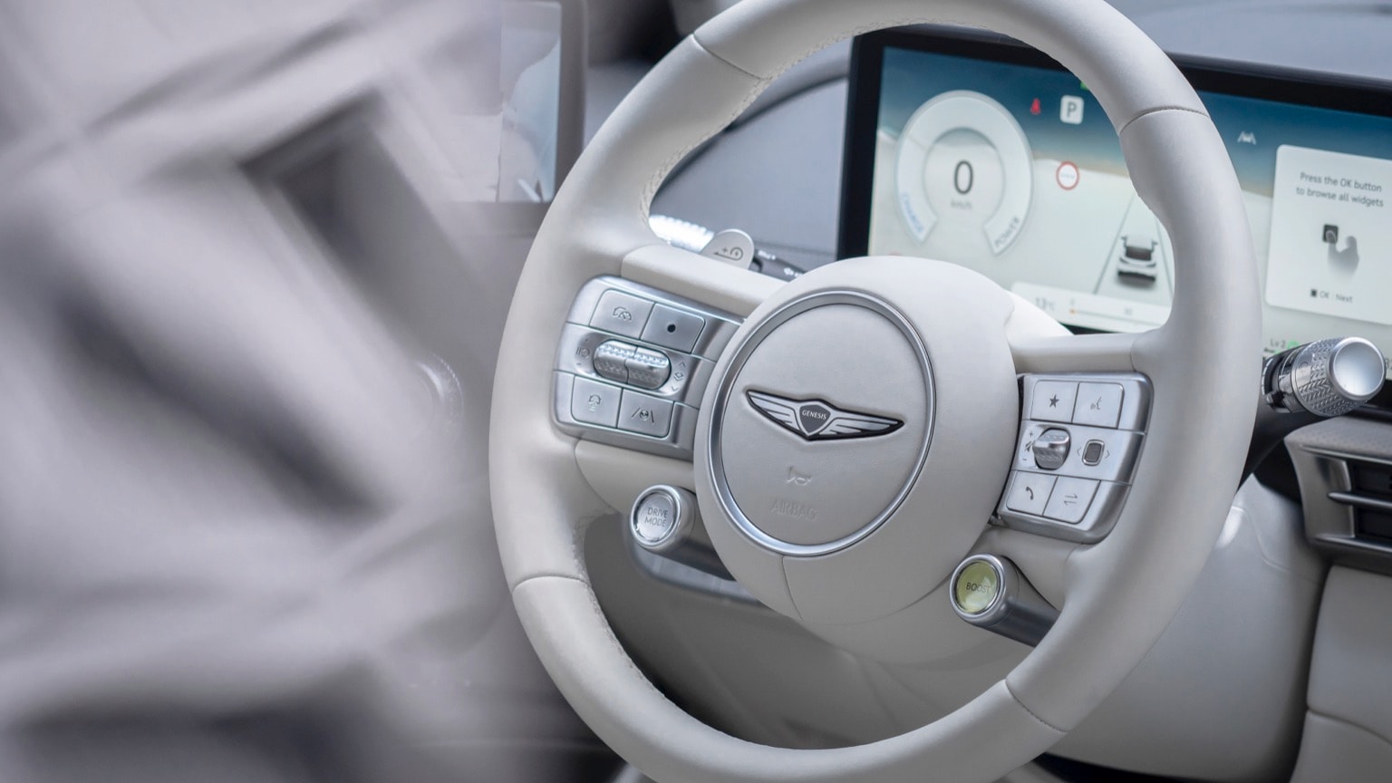 a steering wheel and a screen