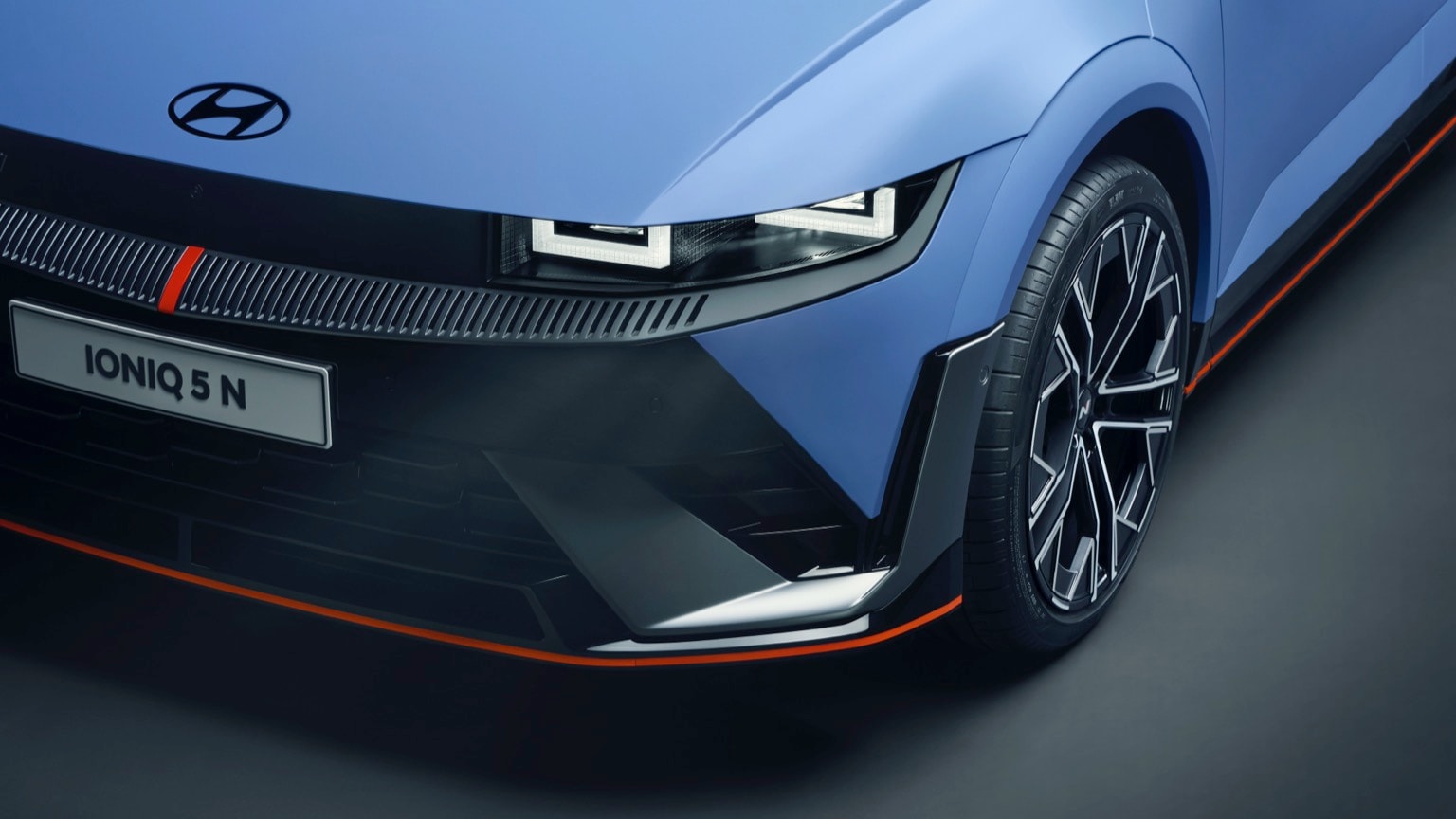 the front end of a blue car