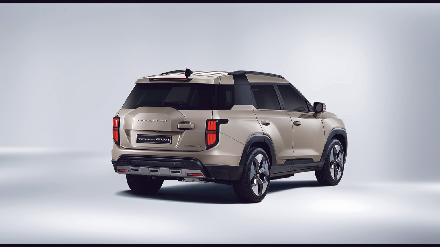 a silver suv with black trim