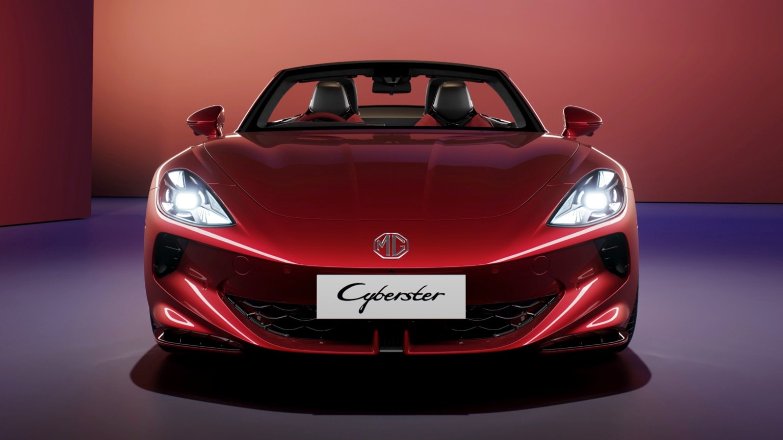 a red sports car with its headlights on