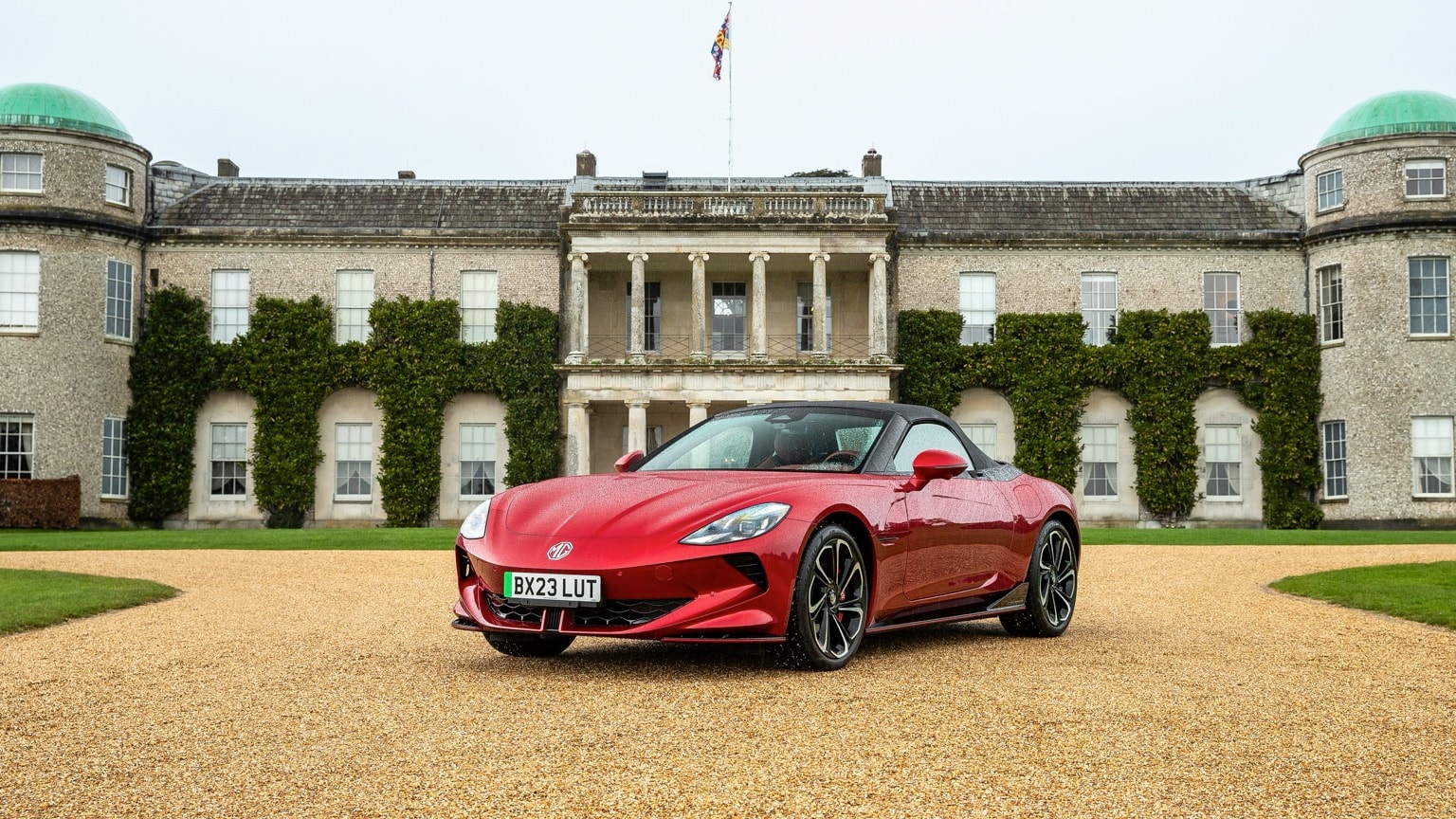 a red sports car parked in front of a building