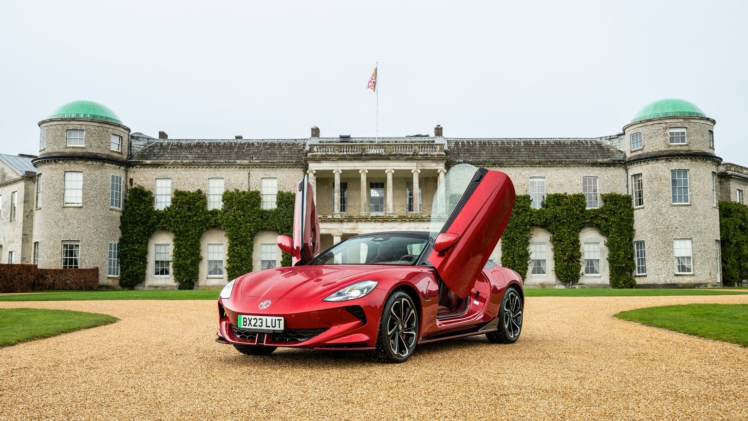 a red sports car with doors open