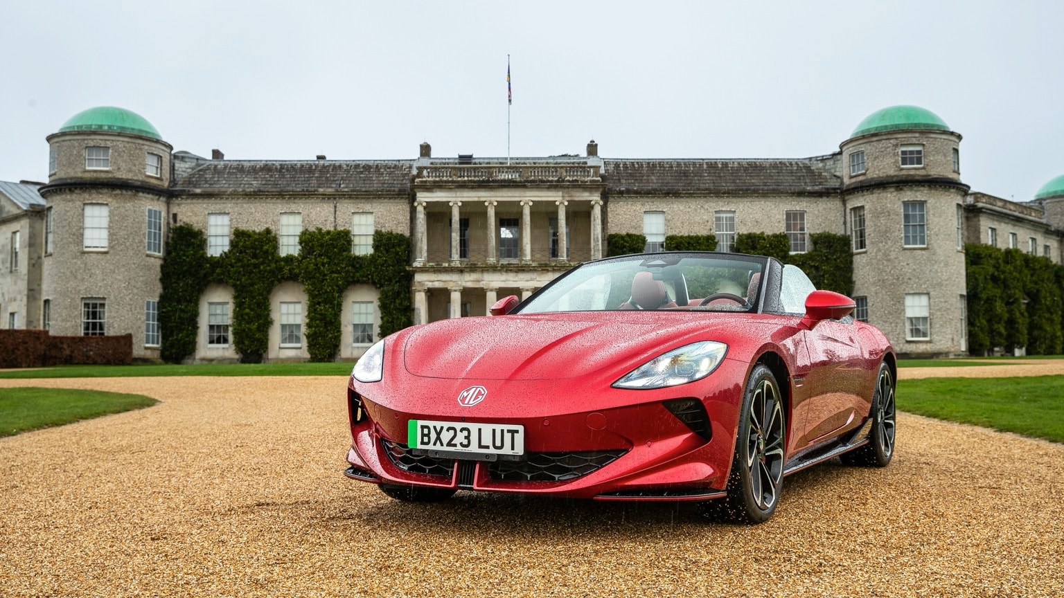 a red sports car parked in front of a building