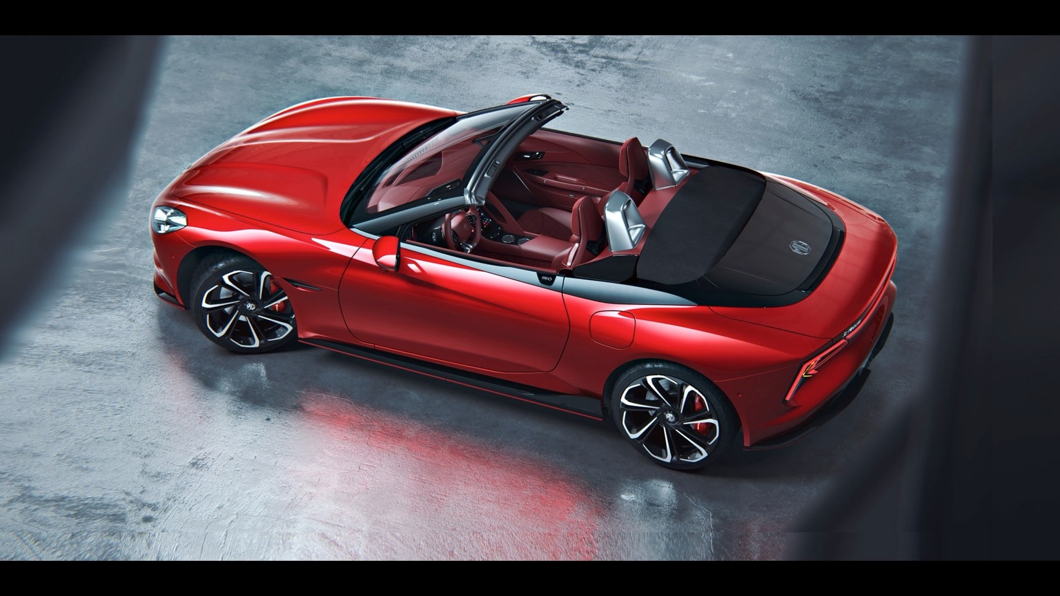 a red convertible car with black roof