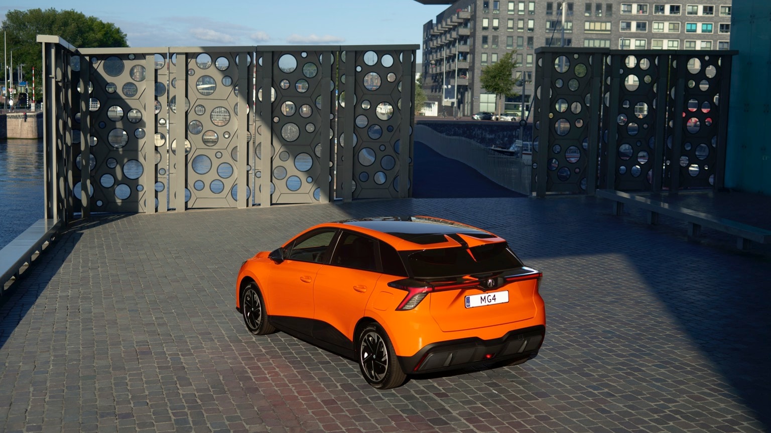 an orange car parked on a brick surface