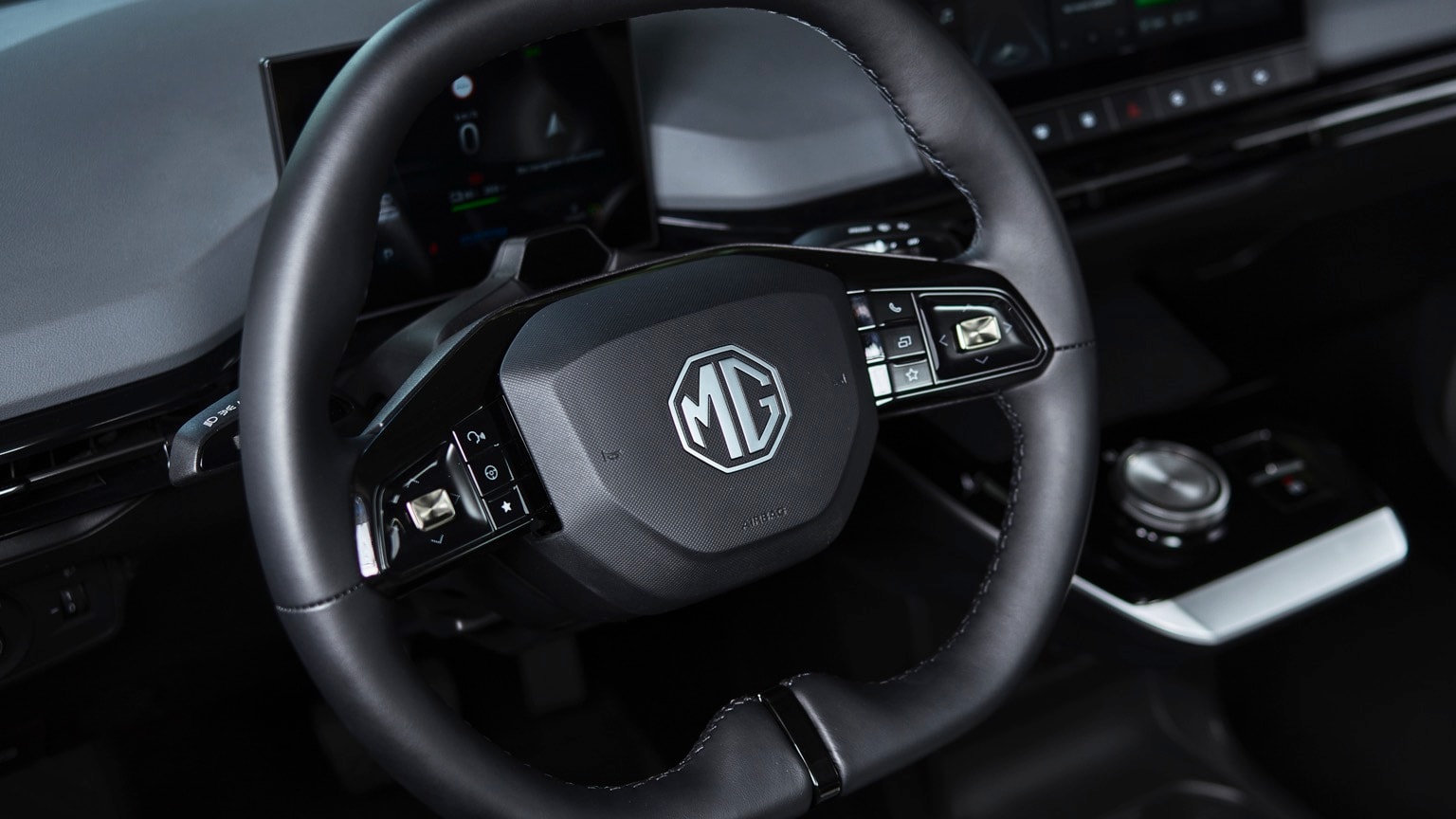 a steering wheel and dashboard of a car