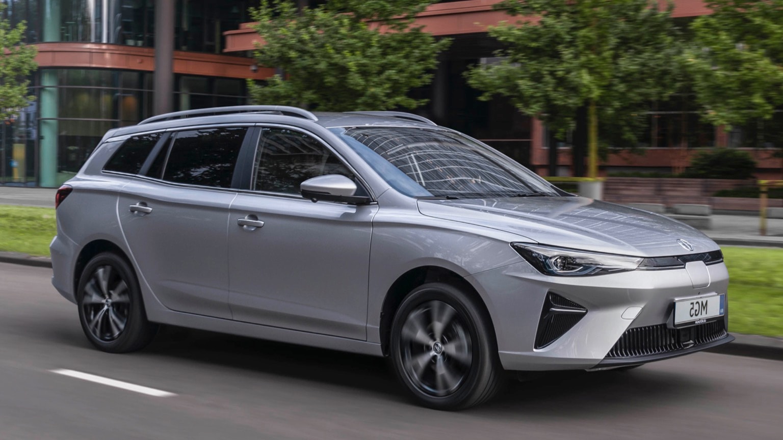 a silver car on the road