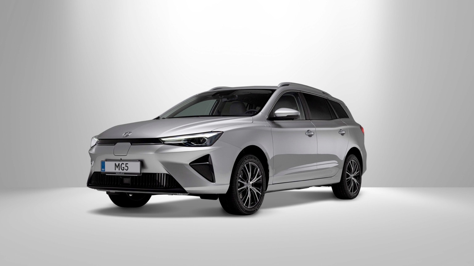a silver car with black wheels