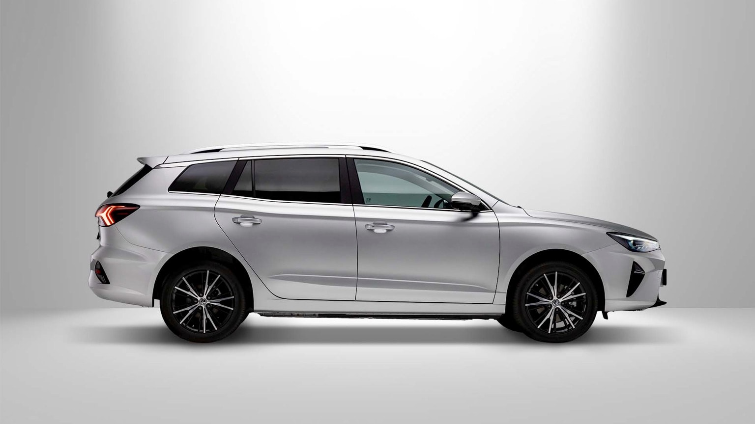 a silver car with black wheels