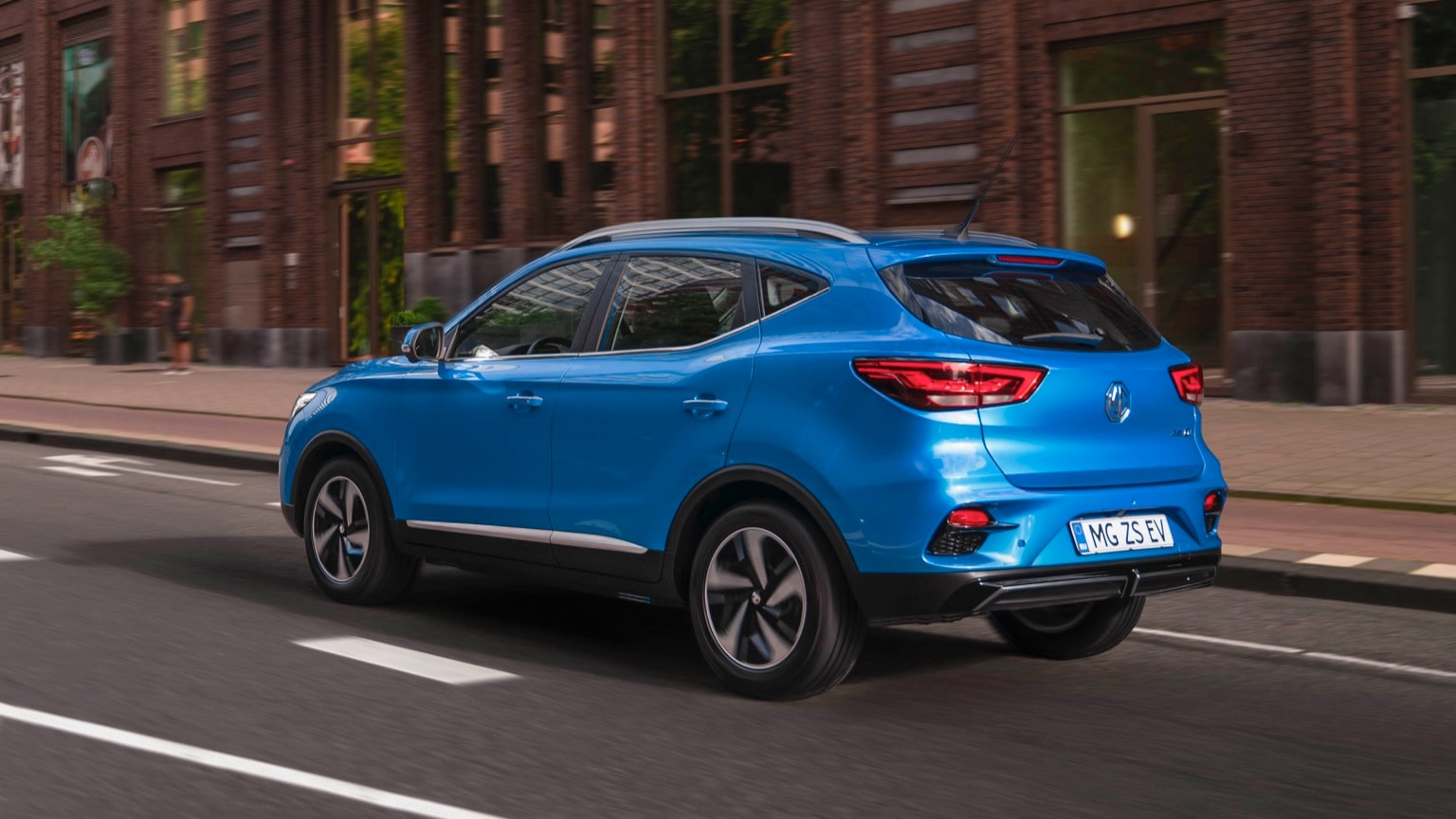 a blue car on the road
