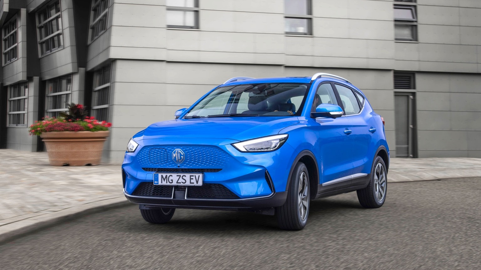 a blue car on the street